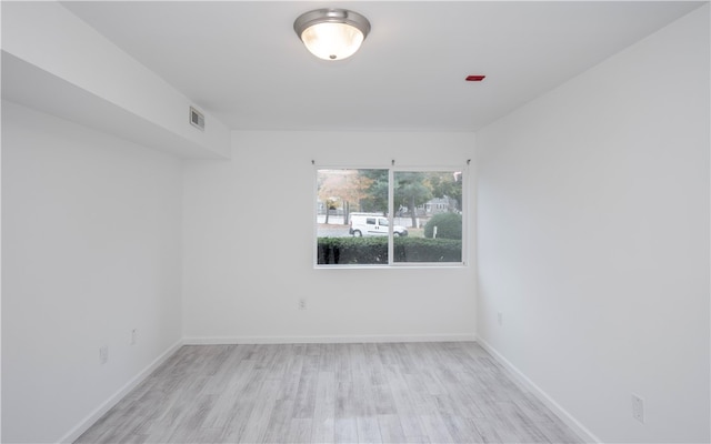 unfurnished room featuring light hardwood / wood-style flooring