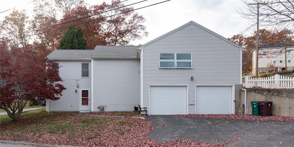 view of side of home with a garage