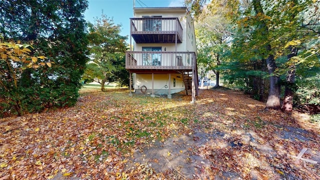 back of house with a balcony