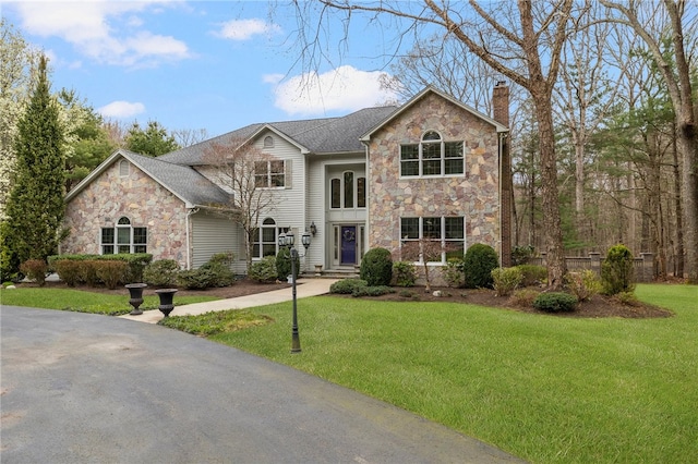 view of property with a front lawn