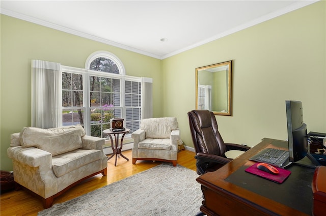 office with crown molding, hardwood / wood-style floors, and a baseboard heating unit