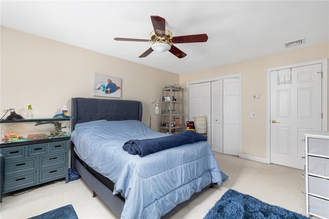 bedroom featuring ceiling fan and light carpet