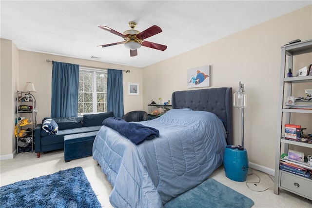 bedroom featuring ceiling fan and light colored carpet