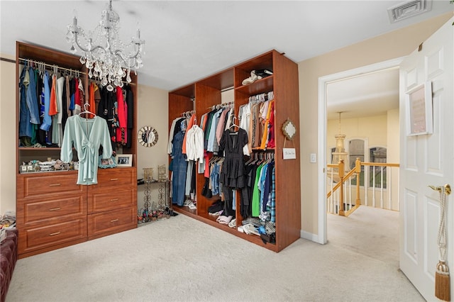 walk in closet featuring light carpet