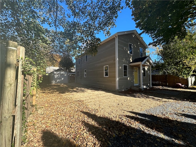 view of home's exterior featuring a storage unit