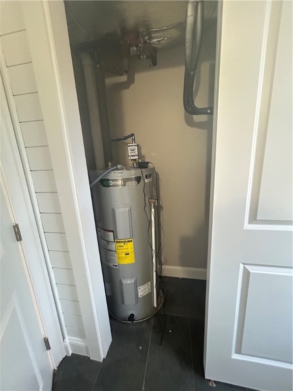 utility room featuring water heater