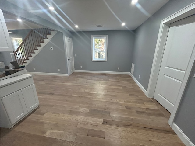 unfurnished living room with light hardwood / wood-style floors