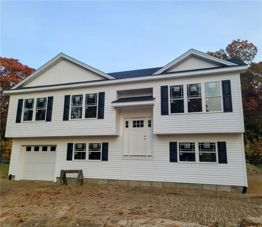 split foyer home featuring a garage