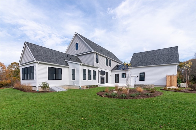 rear view of house with a lawn