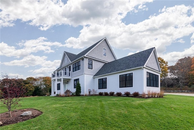 416 Bridgetown Rd, South Kingstown, RI 02874 - traditional home featuring a balcony, roof with shingles, and a front lawn