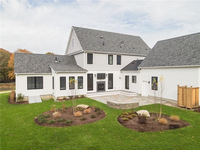 416 Bridgetown Rd, South Kingstown, RI 02874 - back of house with roof with shingles, a patio, and a yard