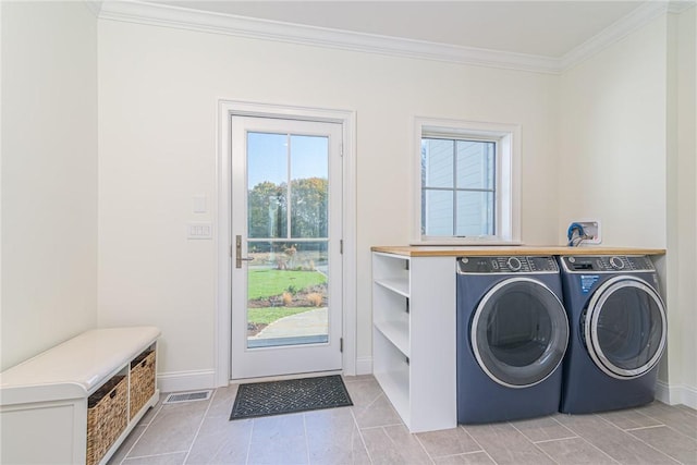 416 Bridgetown Rd, South Kingstown, RI 02874 - washroom featuring washing machine and clothes dryer, laundry area, baseboards, visible vents, and ornamental molding