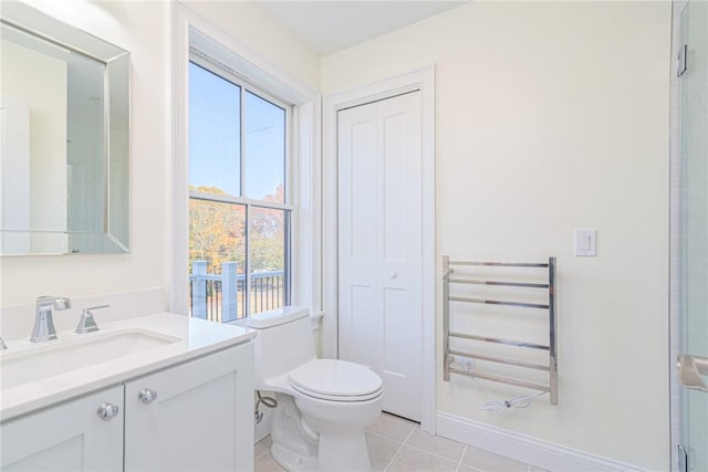 416 Bridgetown Rd, South Kingstown, RI 02874 - bathroom with vanity, radiator, toilet, tile patterned floors, and a shower with shower door