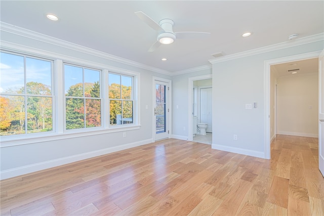 empty room featuring light hardwood / wood-style flooring, ceiling fan, and crown molding