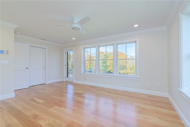 unfurnished bedroom with ornamental molding, multiple windows, light wood-type flooring, and ceiling fan