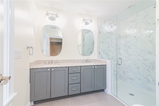 bathroom featuring vanity, tile patterned floors, and an enclosed shower