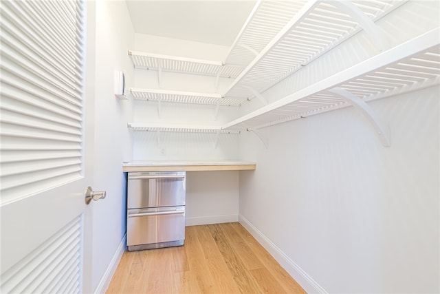 spacious closet featuring light hardwood / wood-style flooring