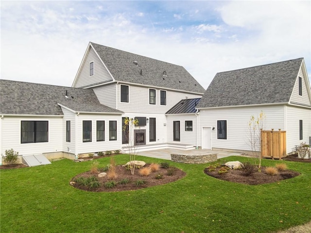 416 Bridgetown Rd, South Kingstown, RI 02874 - back of house featuring a lawn, a patio, and a shingled roof