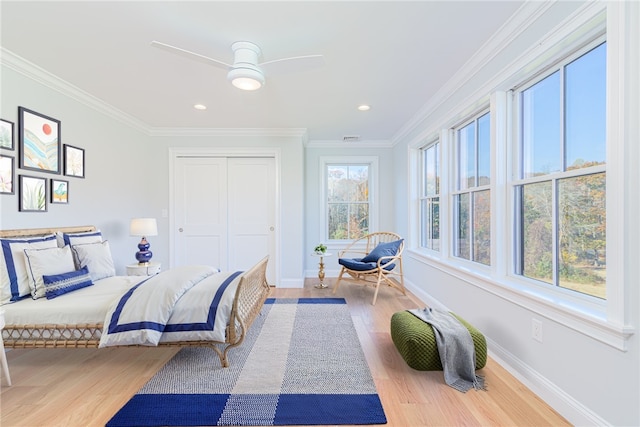 416 Bridgetown Rd, South Kingstown, RI 02874 - bedroom featuring crown molding, baseboards, wood finished floors, and a closet
