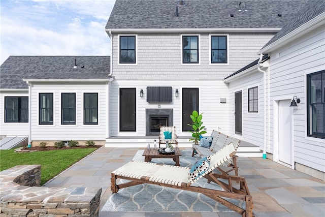 416 Bridgetown Rd, South Kingstown, RI 02874 - back of house with a shingled roof and a patio area