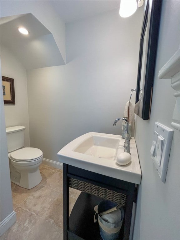 bathroom featuring vanity, toilet, and tile patterned flooring