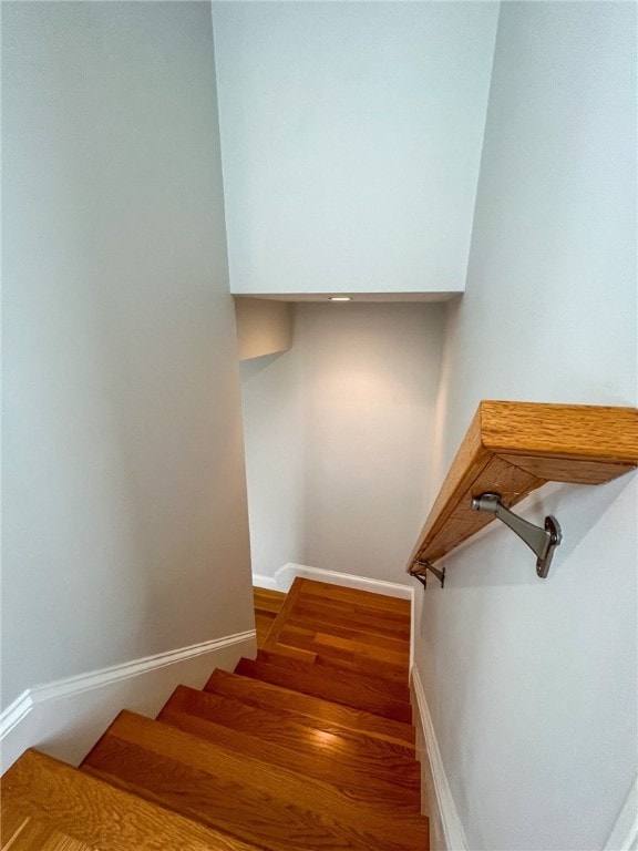 staircase featuring hardwood / wood-style flooring