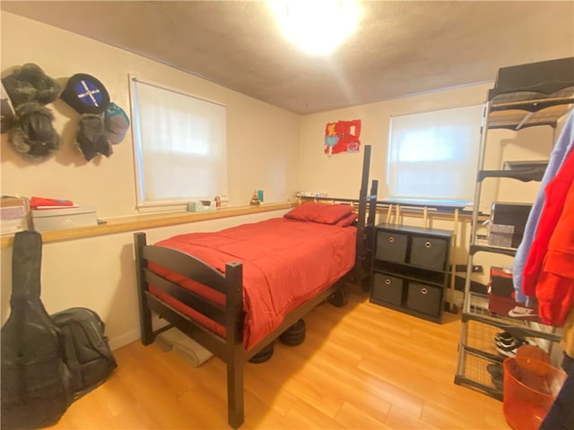 bedroom with light hardwood / wood-style flooring