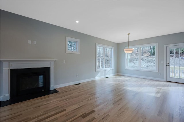 unfurnished living room featuring light hardwood / wood-style flooring