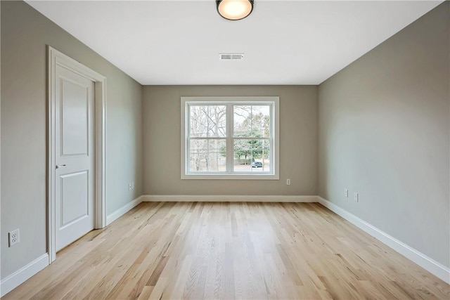 unfurnished room featuring light hardwood / wood-style flooring