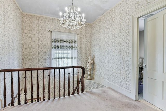 interior space with an inviting chandelier, ornamental molding, and carpet floors