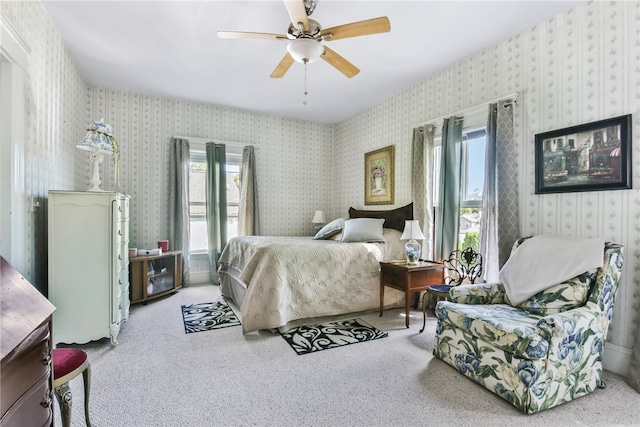 bedroom with ceiling fan and carpet floors