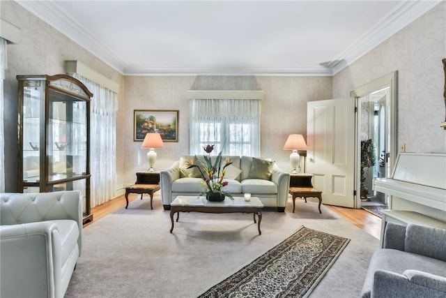 living room with light hardwood / wood-style flooring and crown molding