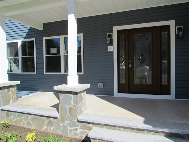 property entrance with covered porch