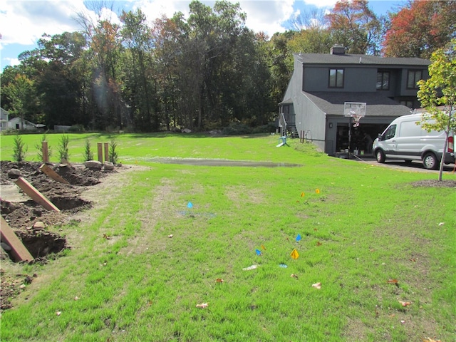 view of yard featuring a garage