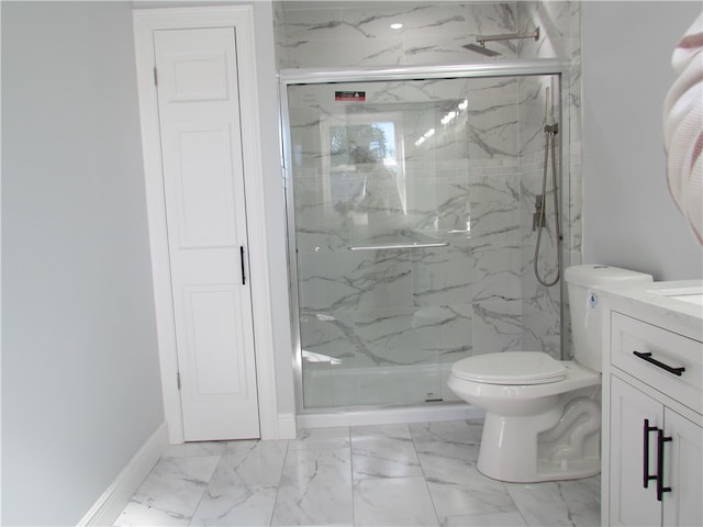 bathroom with vanity, a shower with shower door, and toilet