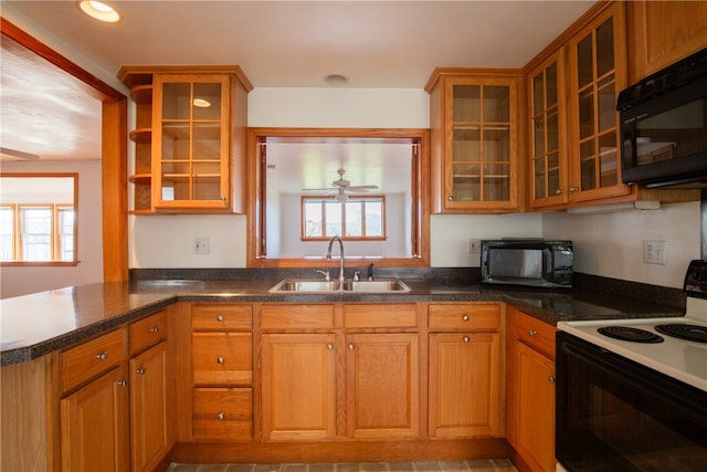 kitchen featuring ceiling fan, sink, kitchen peninsula, and white range with electric stovetop