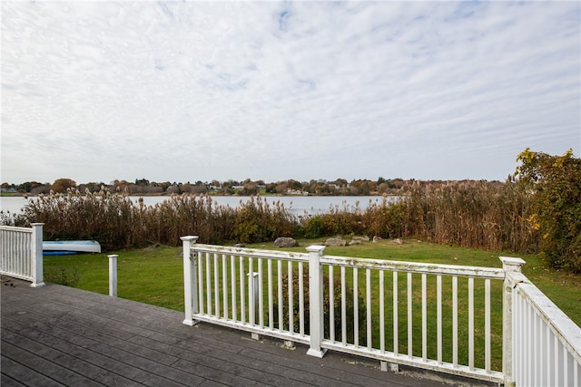 deck featuring a yard and a water view