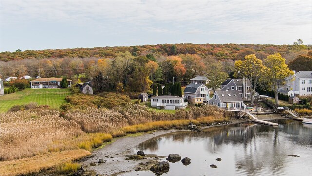 birds eye view of property with a water view