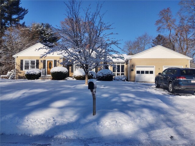 single story home featuring a garage