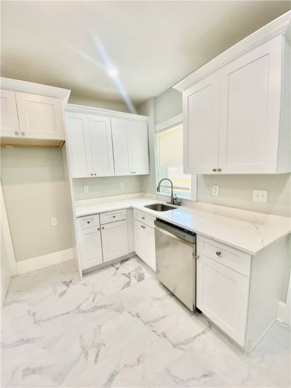 kitchen featuring white cabinets, light stone countertops, sink, and dishwasher