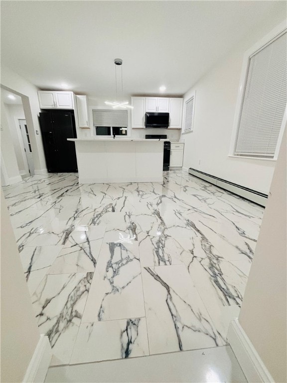 kitchen with a baseboard radiator, black appliances, white cabinetry, and decorative light fixtures