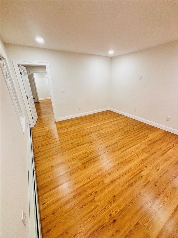 unfurnished room with light wood-type flooring