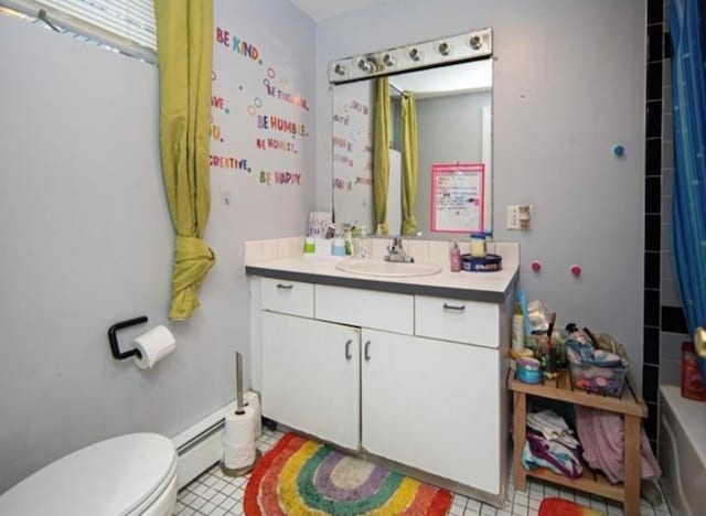 bathroom featuring vanity, toilet, and a baseboard heating unit