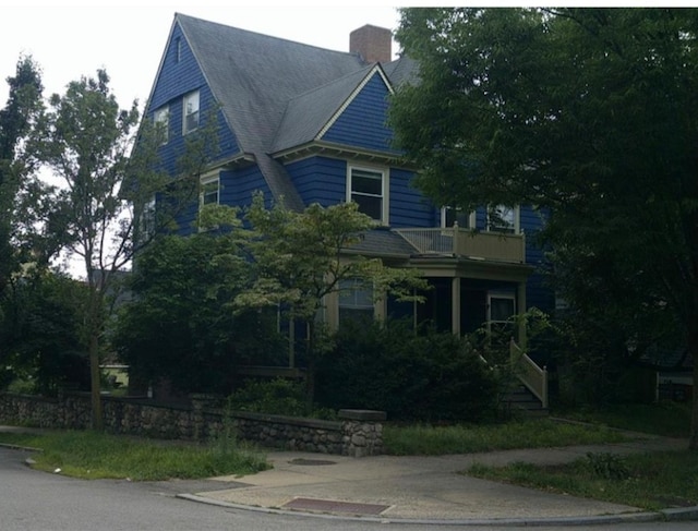 view of front of home with a balcony