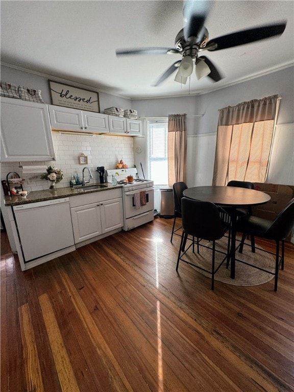 kitchen with white cabinets, dishwasher, range, sink, and dark hardwood / wood-style floors