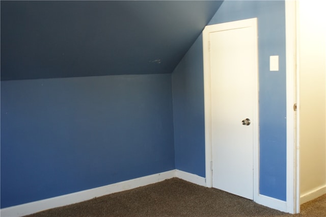 bonus room featuring vaulted ceiling and carpet floors