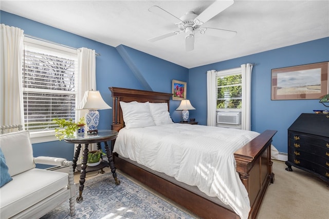 bedroom with cooling unit, light carpet, and ceiling fan