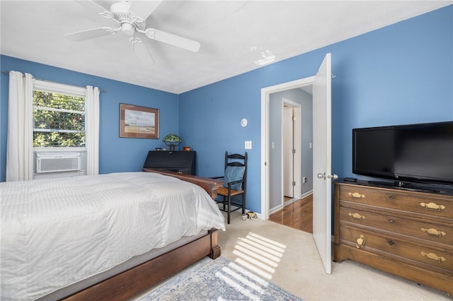 carpeted bedroom with cooling unit and ceiling fan