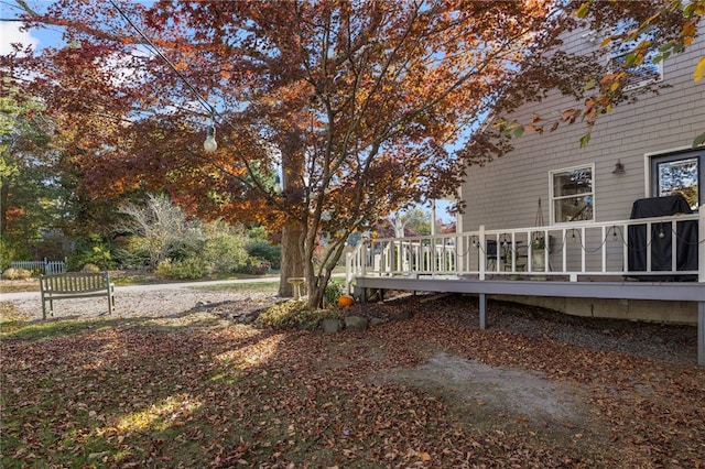 view of yard with a wooden deck