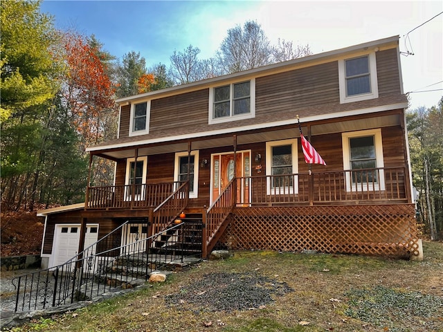 view of front facade with a garage and covered porch